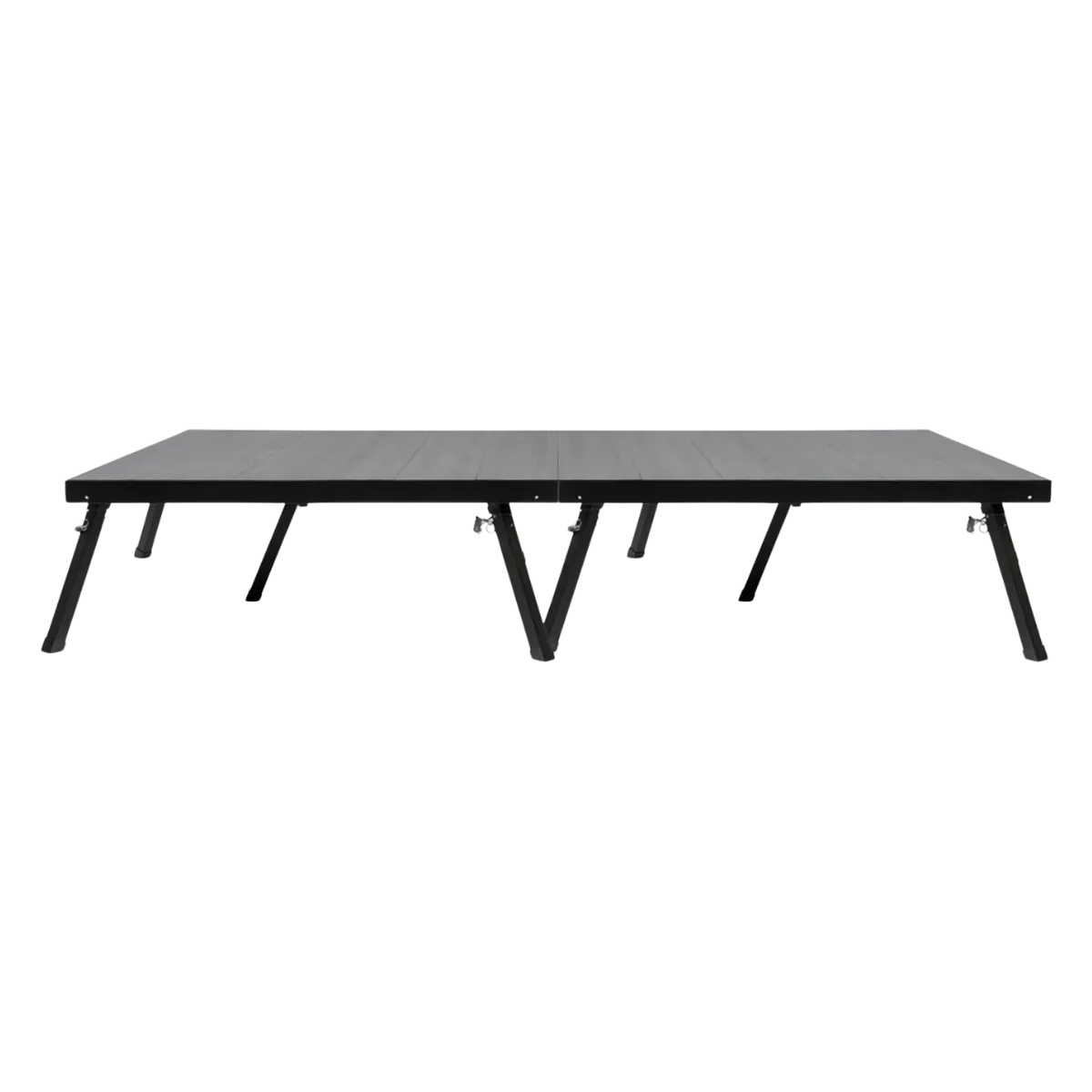 Two square stage decks connected side by side into one long platform, the ribbed black top carried on splayed black legs with a further leg standing under the centre of each deck