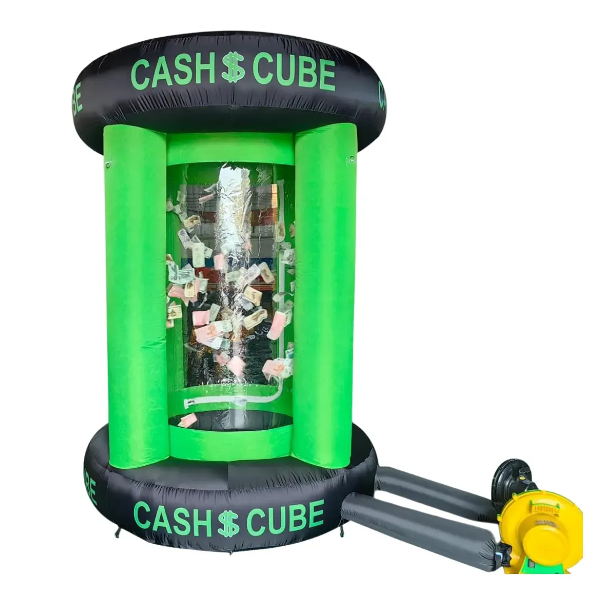 A cylindrical inflatable money booth with green side columns between a black top ring and a black base ring, both printed Cash Cube, a clear chamber through the middle with banknotes blowing around inside it and a yellow blower connected by a hose at the side
