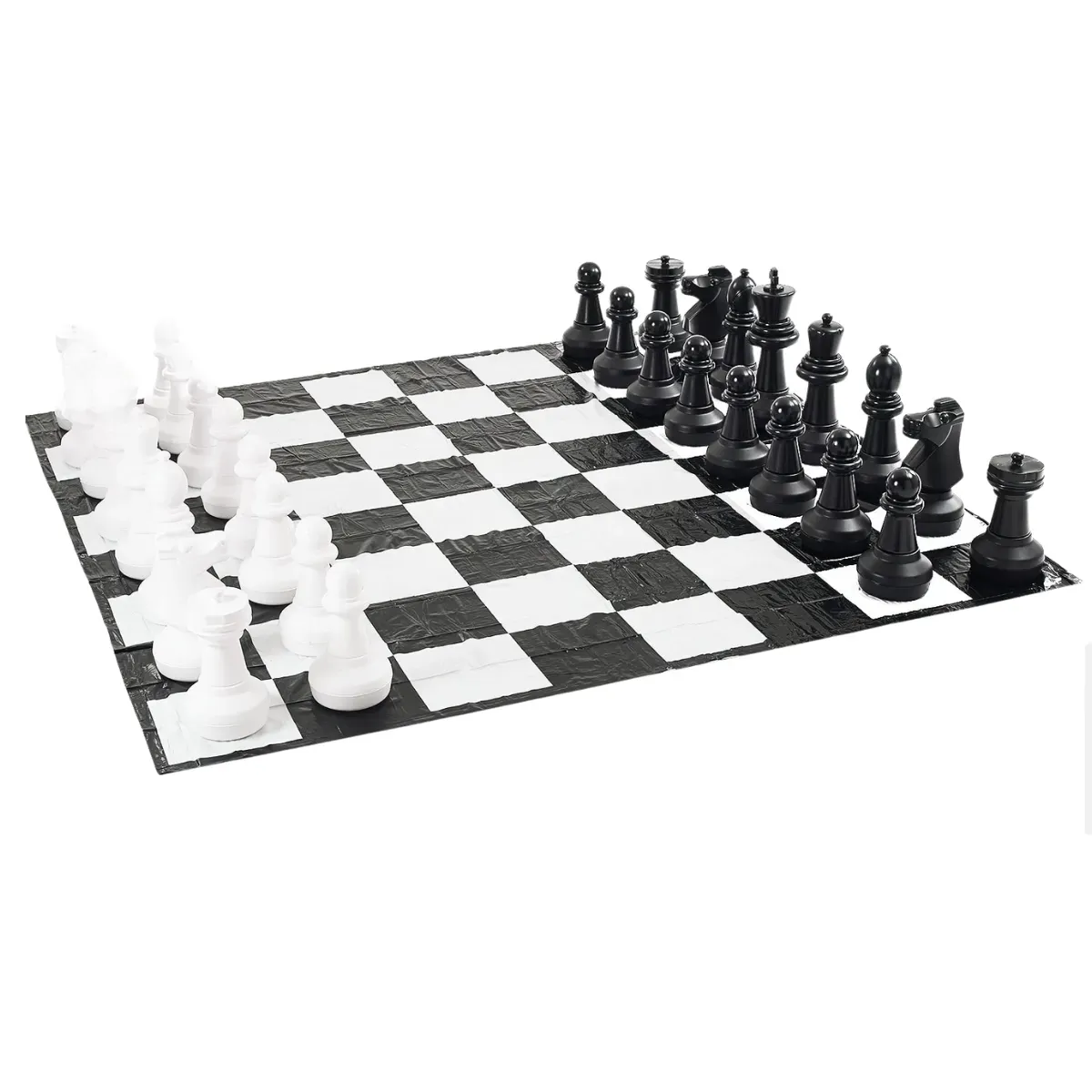 An oversized chess set laid out on a folding black and white vinyl mat, moulded white pieces ranked along one side and matt black pieces along the other, the kings standing roughly twice the height of the pawns