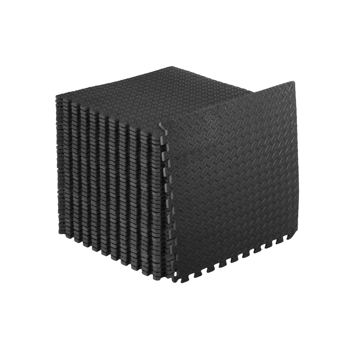 A stack of black foam floor tiles with one tile stood on edge against it, the top face carrying the textured non-skid moulding and jigsaw teeth running down every side
