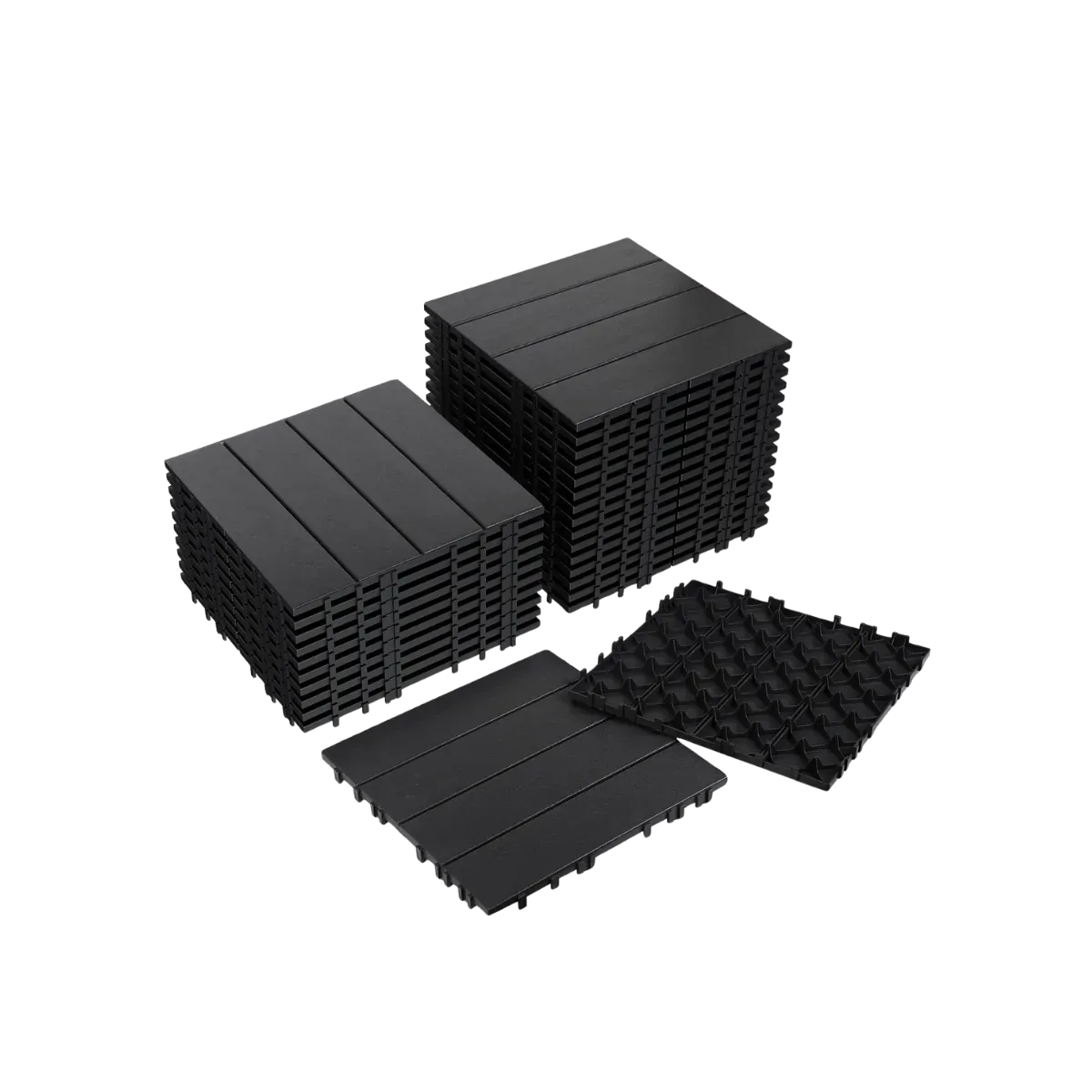 Two stacks of black plastic deck tiles beside a single tile turned face down, the walking side four broad flat slats and the underside an open grid of short pegs