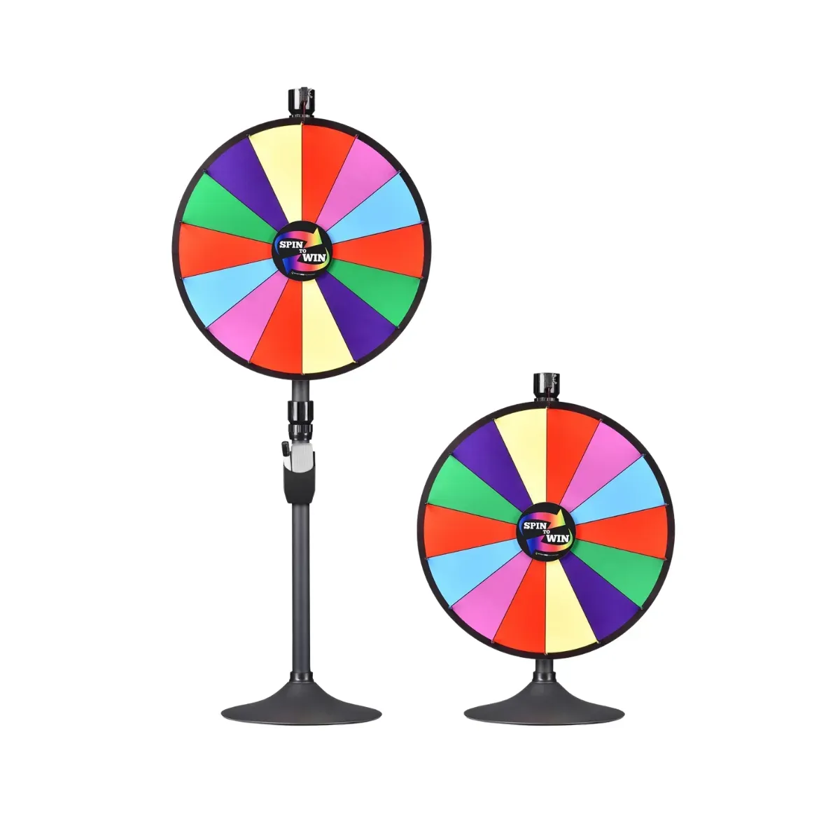The same prize wheel shown twice, once raised on a tall black floor pole and once low on a short tabletop pole, each face divided into coloured wedges around a hub reading Spin to Win with a pointer at the top