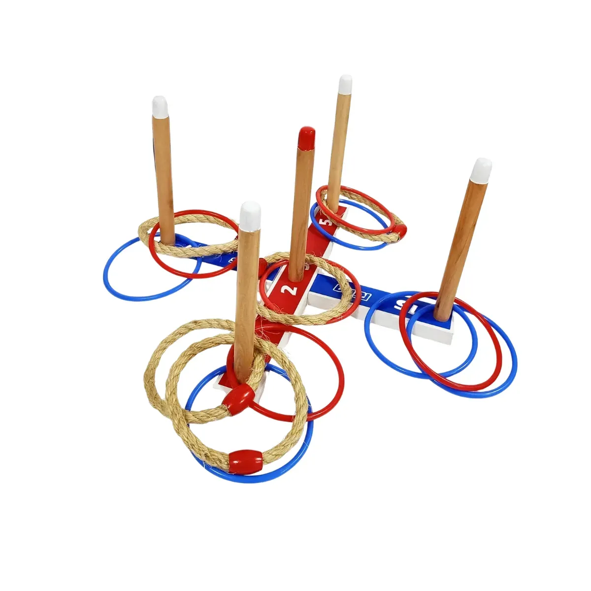A ring toss base built as a painted wooden cross in red, white and blue with scoring numbers along the arms, five turned wooden pegs standing up out of it and rope rings and plastic rings hooked over the pegs or lying around it