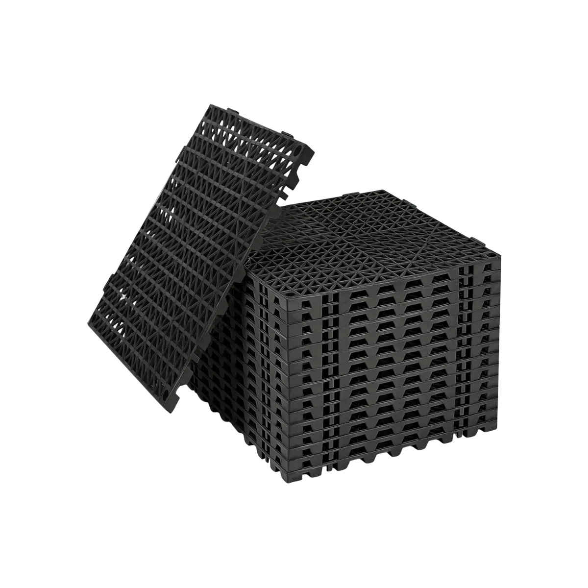 Black perforated drainage tiles stacked in a block with one laid across the top, the walking face an open triangular lattice carried on a base of short support ribs